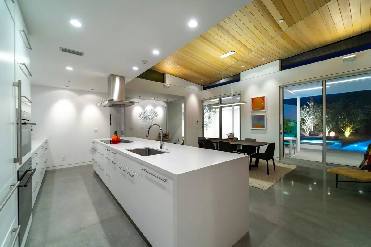 Modern kitchen showing classified building components: countertops, appliances, fixtures, flooring, lighting, cabinetry