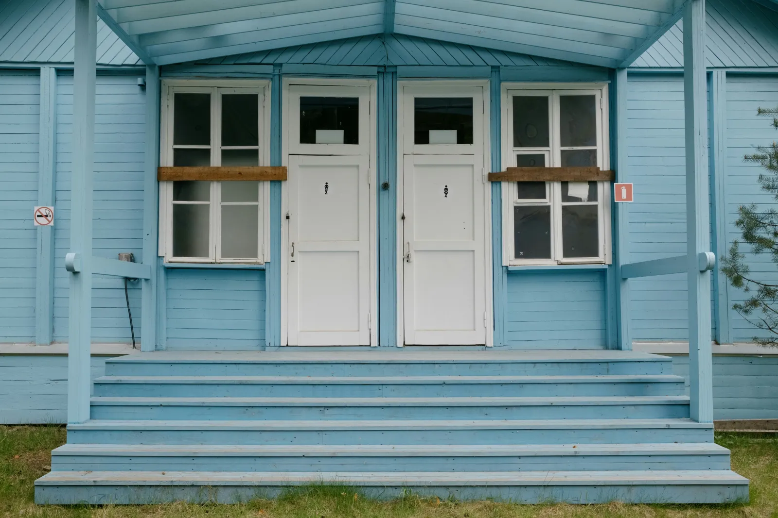 Fourplex residential building with multiple unit entrances and shared structure
