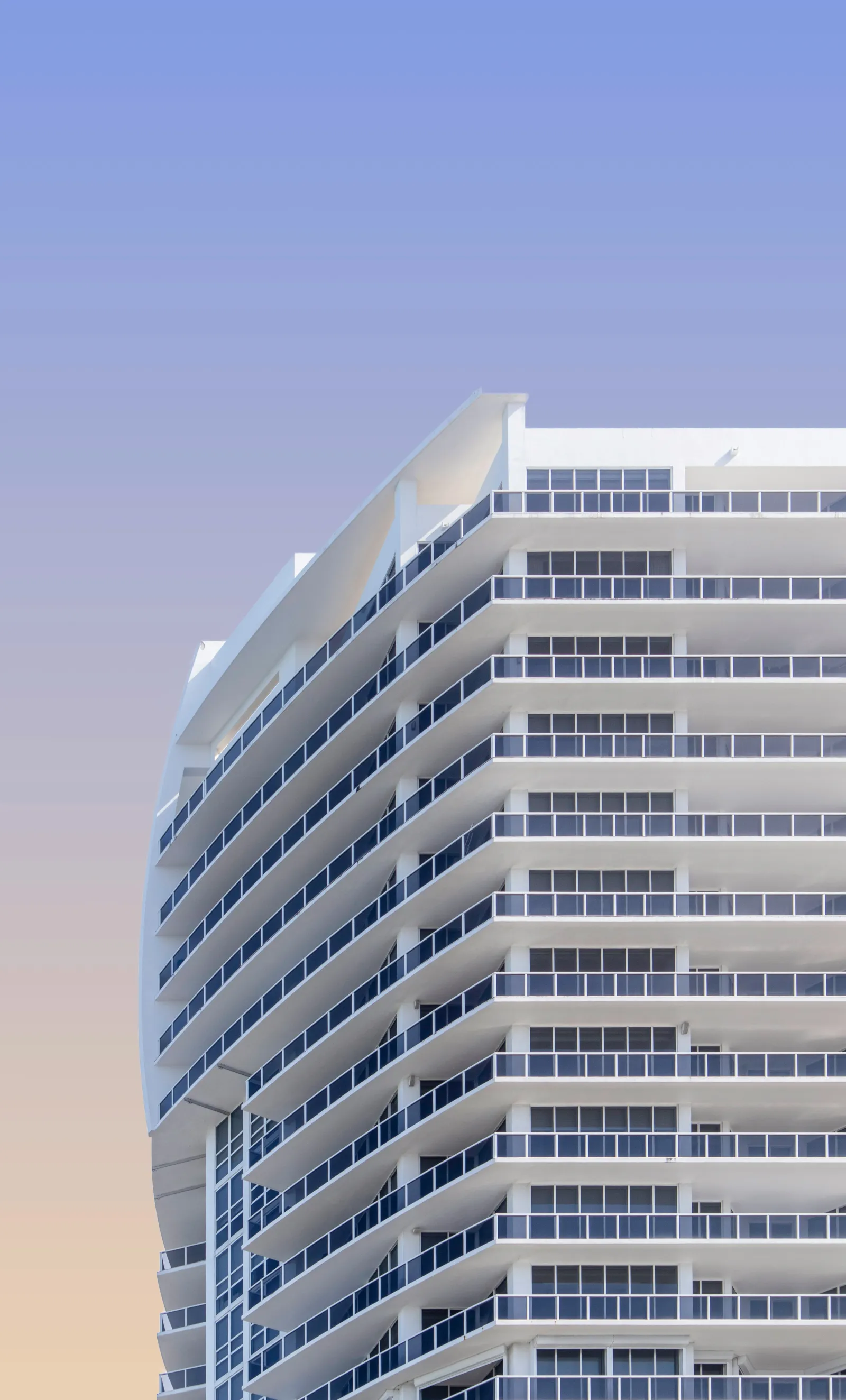 Modern condo building exterior with balconies and contemporary architecture