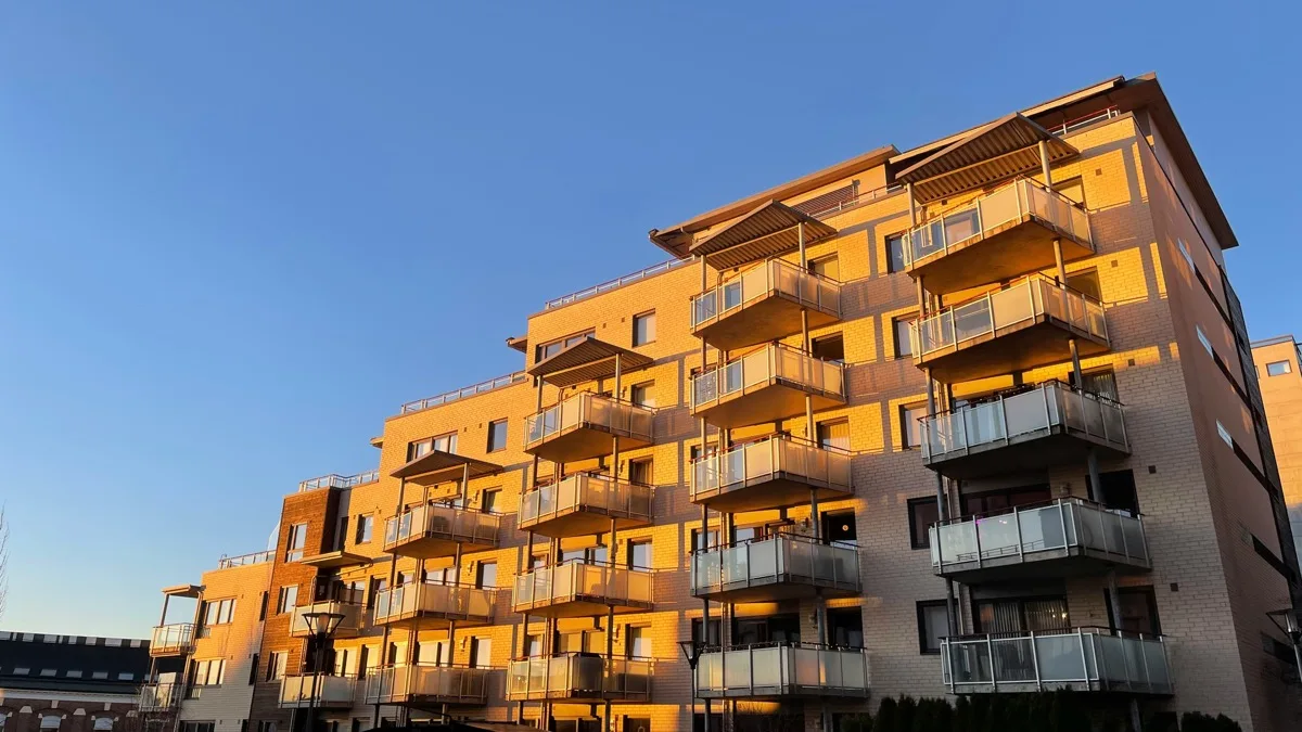 Modern multifamily apartment building exterior with balconies